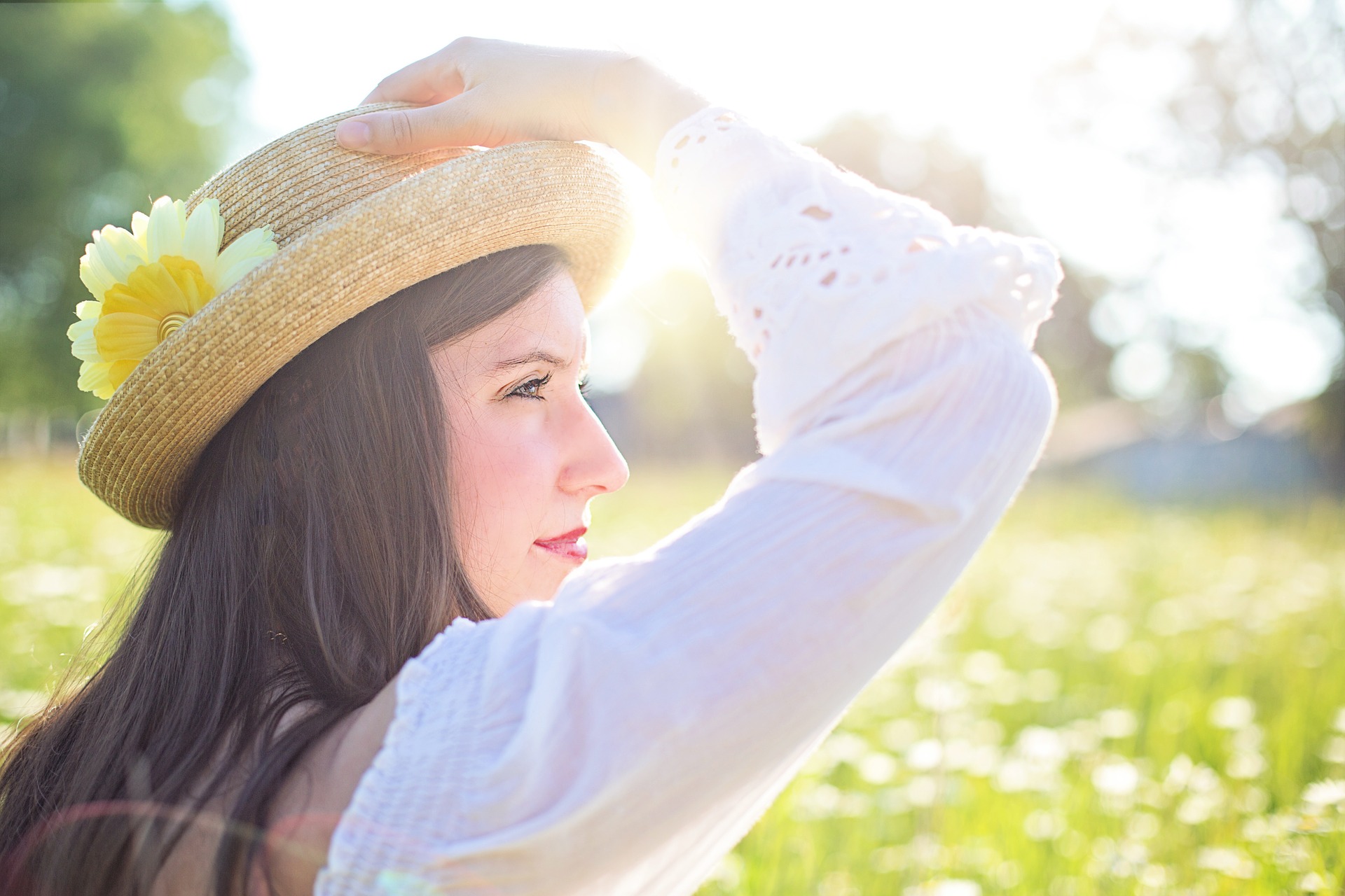 women enjoying the sun in a field