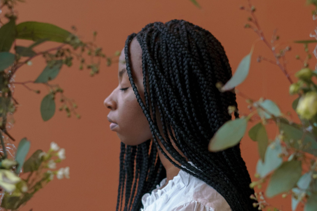 side profile woman with afro hair