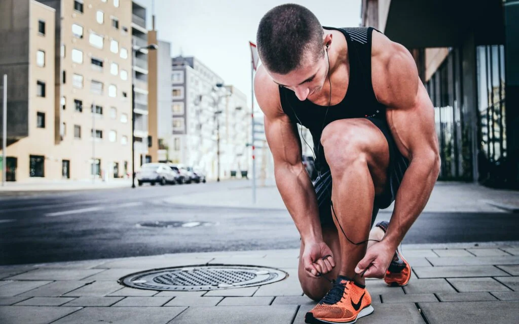 Man running worried about exercise and hair loss