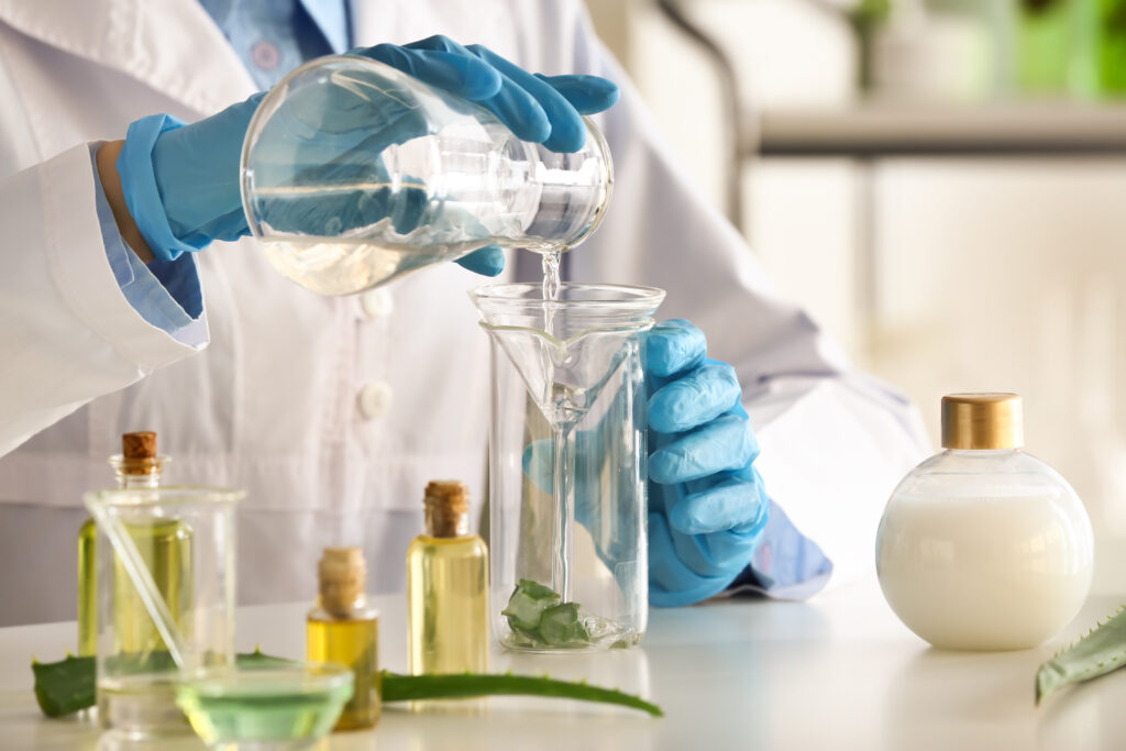 A scientist in a lab is seen measuring shampoo ingredients.